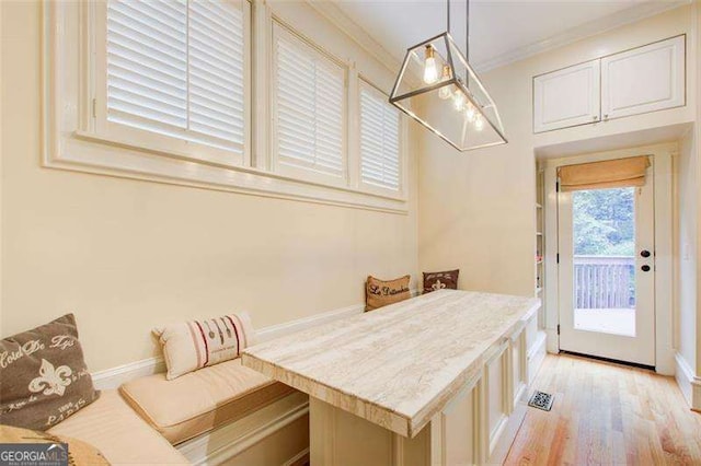 42 Greenland Trce, Atlanta, GA 30342 - dining room featuring light wood-style flooring, crown molding, and baseboards