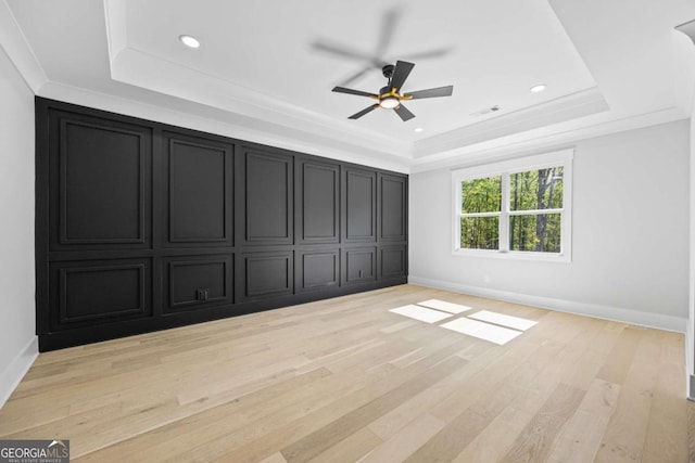407 Thunder Rd, Buford, GA 30518 - unfurnished bedroom with a raised ceiling, light wood-style flooring, recessed lighting, and ceiling fan