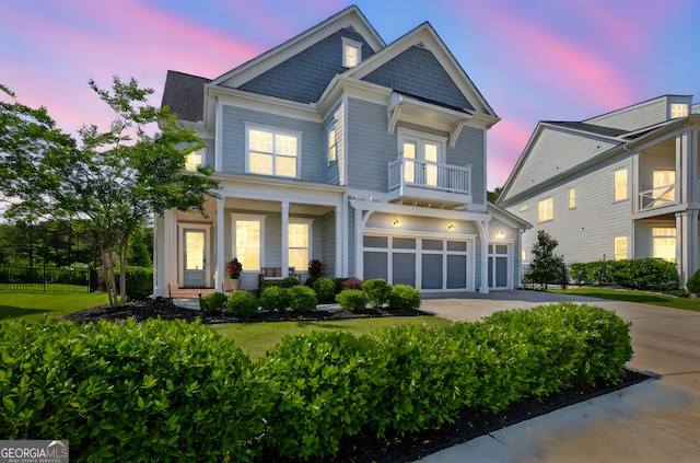 229 Widener Way, Peachtree City, GA 30269 - view of front facade with driveway, covered porch, a garage, and a balcony