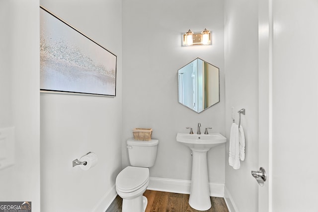 229 Widener Way, Peachtree City, GA 30269 - bathroom featuring baseboards, toilet, and wood finished floors