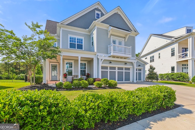 229 Widener Way, Peachtree City, GA 30269 - view of front of property with covered porch, driveway, an attached garage, and a balcony
