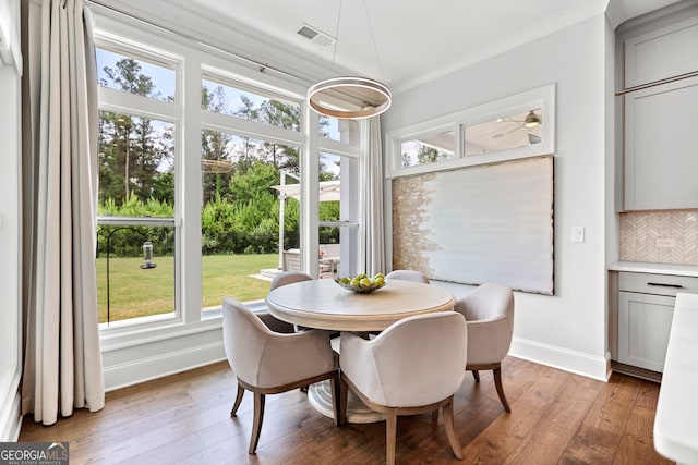 229 Widener Way, Peachtree City, GA 30269 - dining space featuring light wood finished floors and ornamental molding