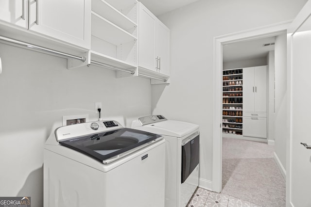229 Widener Way, Peachtree City, GA 30269 - laundry room with washing machine and dryer, cabinet space, and light carpet