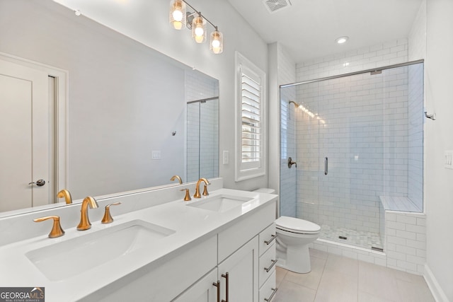 229 Widener Way, Peachtree City, GA 30269 - full bathroom featuring a shower stall, tile patterned flooring, double vanity, and toilet