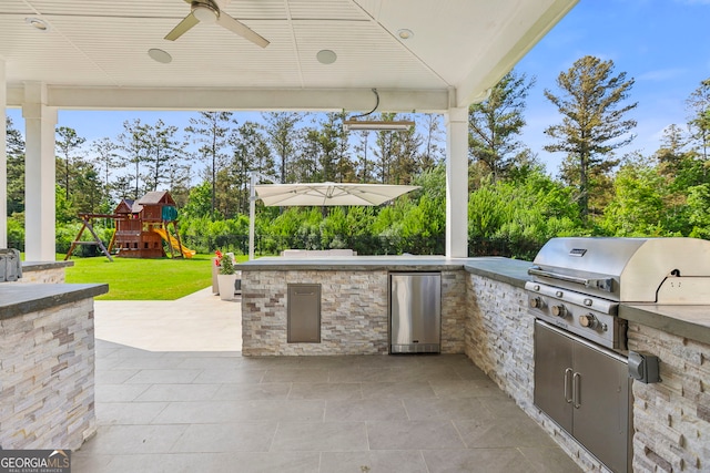 229 Widener Way, Peachtree City, GA 30269 - view of patio with a playground, a ceiling fan, and view of wooded area