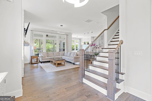 229 Widener Way, Peachtree City, GA 30269 - living room featuring stairs and wood finished floors
