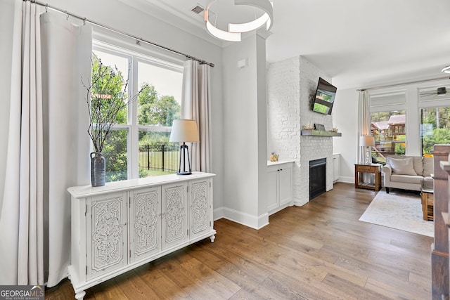 229 Widener Way, Peachtree City, GA 30269 - living area featuring healthy amount of natural light, wood finished floors, and a fireplace