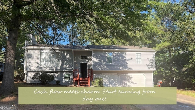 4191 Alaina Cir, Austell, GA 30106 - view of front of house with a garage, driveway, and a chimney