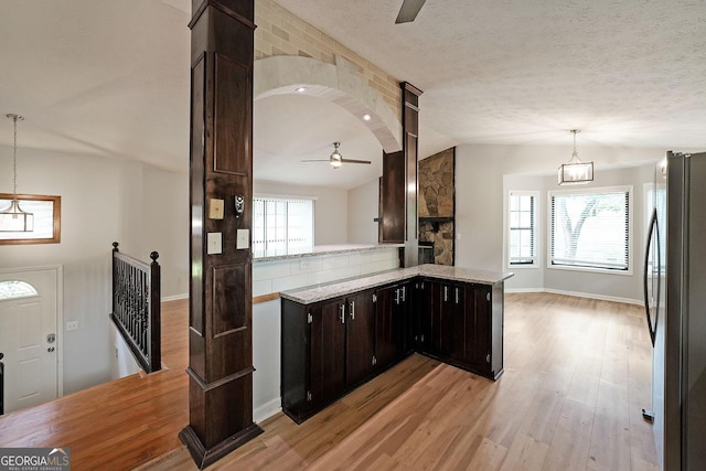 4191 Alaina Cir, Austell, GA 30106 - kitchen featuring a ceiling fan, freestanding refrigerator, vaulted ceiling, light wood-type flooring, and pendant lighting