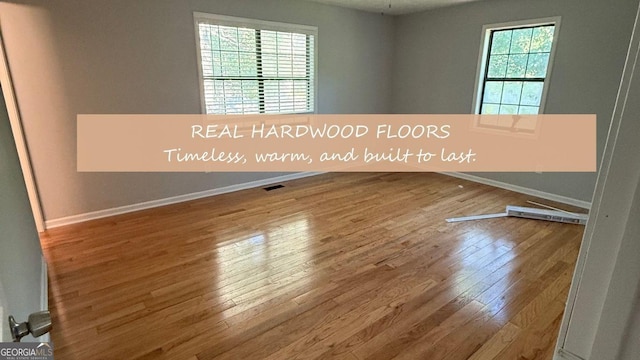 4191 Alaina Cir, Austell, GA 30106 - unfurnished room with hardwood / wood-style flooring and baseboards