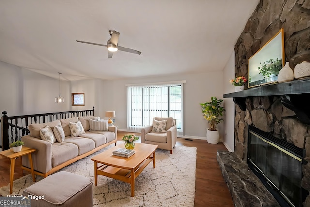 4191 Alaina Cir, Austell, GA 30106 - living room featuring a ceiling fan, wood finished floors, baseboards, and a stone fireplace