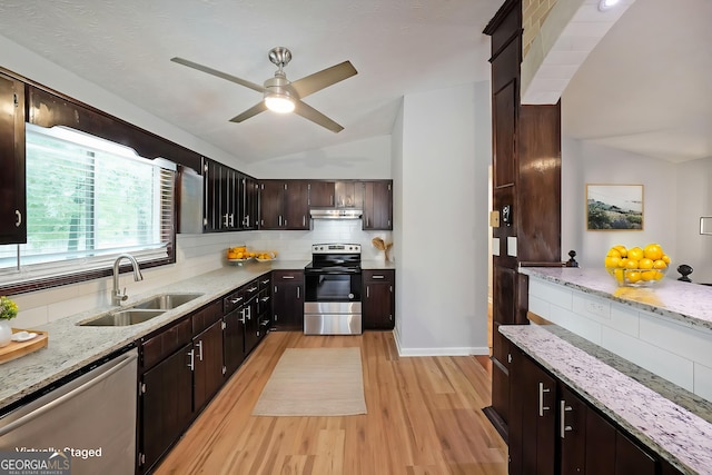 4191 Alaina Cir, Austell, GA 30106 - kitchen with stainless steel appliances, a sink, light wood finished floors, decorative backsplash, and vaulted ceiling