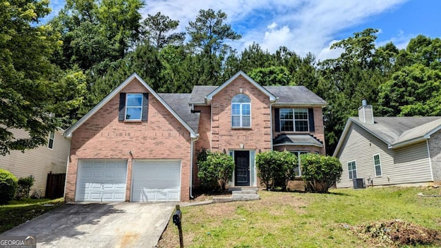 3881 Micah Ln, Ellenwood, GA 30294 - traditional-style house featuring concrete driveway, brick siding, a front yard, and an attached garage