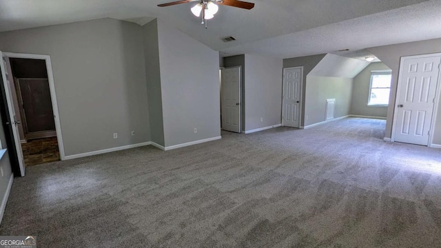 3881 Micah Ln, Ellenwood, GA 30294 - additional living space with lofted ceiling, ceiling fan, carpet floors, and baseboards