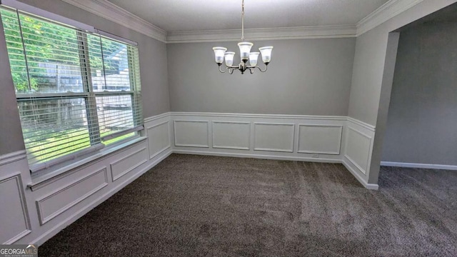 3881 Micah Ln, Ellenwood, GA 30294 - spare room featuring a chandelier, dark carpet, crown molding, wainscoting, and a decorative wall