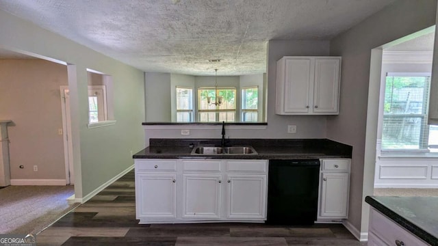 3881 Micah Ln, Ellenwood, GA 30294 - kitchen with dishwasher, a sink, dark countertops, white cabinetry, and dark wood-style flooring