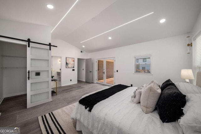 681 Fielding Ln SW, Atlanta, GA 30311 - bedroom featuring lofted ceiling, a barn door, wood finished floors, recessed lighting, and access to outside