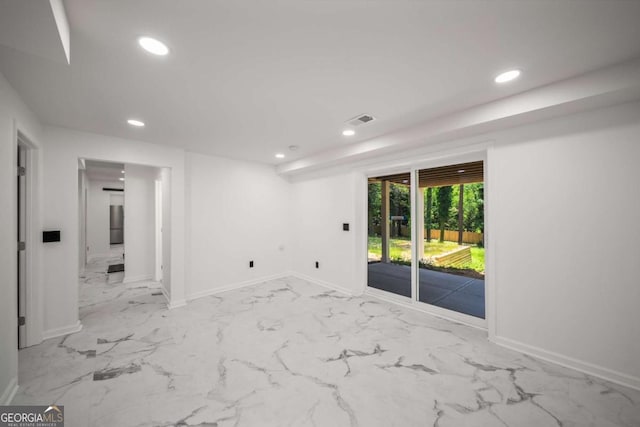 681 Fielding Ln SW, Atlanta, GA 30311 - empty room with recessed lighting and marble look tile flooring