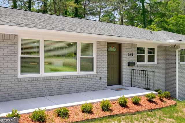681 Fielding Ln SW, Atlanta, GA 30311 - view of front facade featuring brick siding and roof with shingles