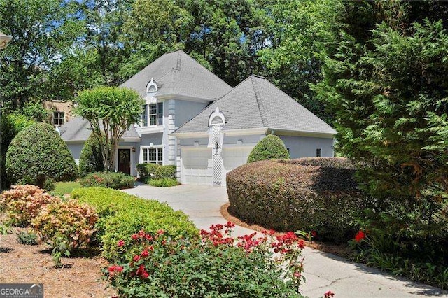 1050 Shady Valley Pl, Atlanta, GA 30324 - view of front facade featuring an attached garage and concrete driveway