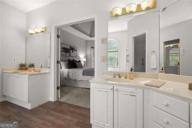 1050 Shady Valley Pl, Atlanta, GA 30324 - ensuite bathroom featuring wood finished floors and vanity