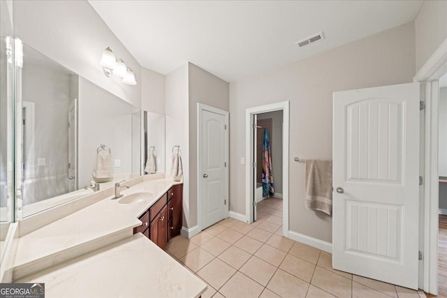 1323 Frey Lake Ct NW, Kennesaw, GA 30144 - full bath featuring vanity, tile patterned flooring, baseboards, and a closet