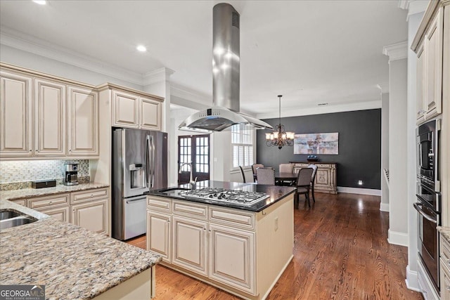 1323 Frey Lake Ct NW, Kennesaw, GA 30144 - kitchen featuring cream cabinetry, island range hood, stainless steel appliances, a sink, and a chandelier