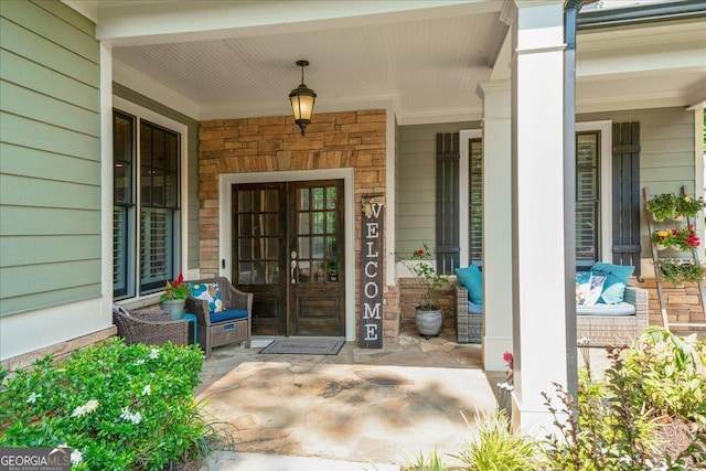 1323 Frey Lake Ct NW, Kennesaw, GA 30144 - doorway to property featuring french doors, covered porch, and stone siding