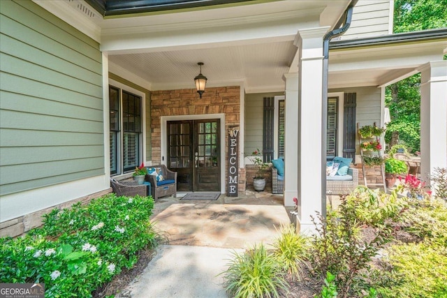 1323 Frey Lake Ct NW, Kennesaw, GA 30144 - doorway to property featuring covered porch, french doors, and stone siding