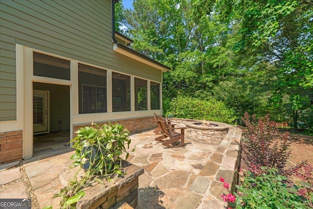 1323 Frey Lake Ct NW, Kennesaw, GA 30144 - view of patio / terrace with a fire pit and a sunroom