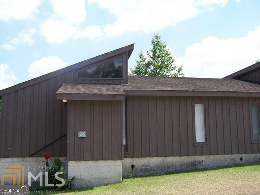 161 Valley Rd, Statesboro, GA 30458 - view of home's exterior featuring a yard and a shingled roof