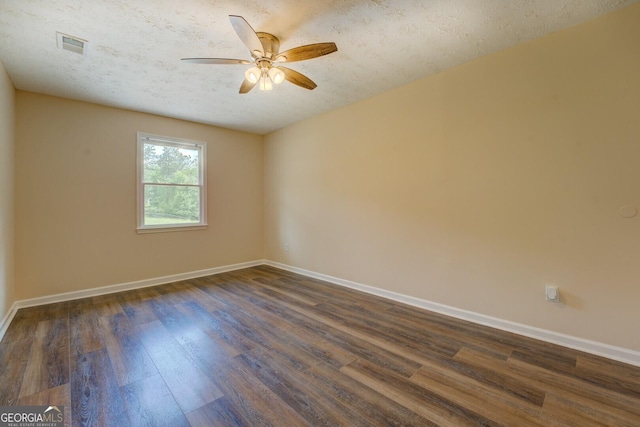 170 Hidden Pines Dr, Covington, GA 30016 - unfurnished room featuring dark wood finished floors, ceiling fan, baseboards, and a textured ceiling