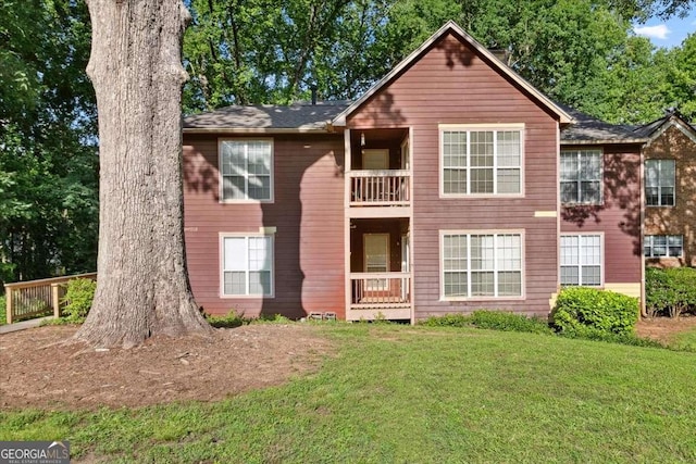 5555 Mountain Springs Cir, Stone Mountain, GA 30088 - view of front of house featuring a front yard and a balcony