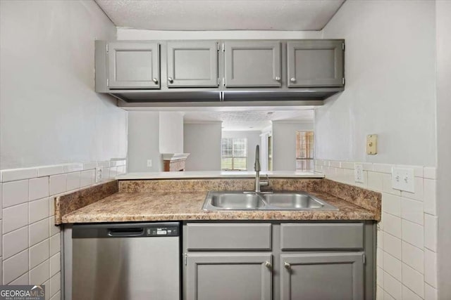 5555 Mountain Springs Cir, Stone Mountain, GA 30088 - kitchen featuring dishwasher, tile walls, gray cabinetry, wainscoting, and light countertops