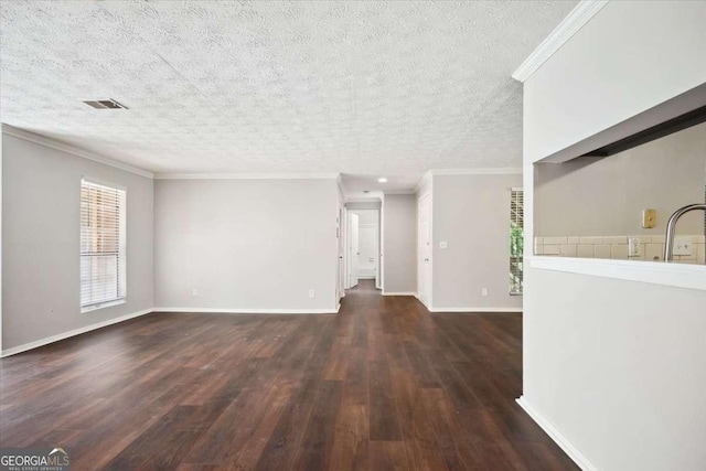 5555 Mountain Springs Cir, Stone Mountain, GA 30088 - unfurnished living room with crown molding, wood finished floors, a textured ceiling, baseboards, and a sink