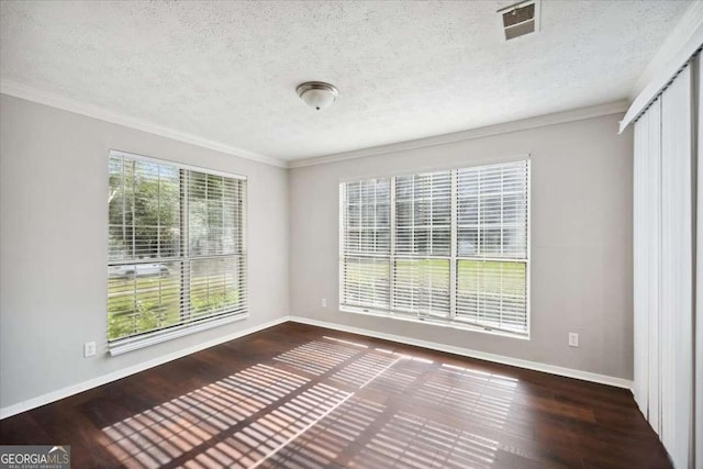 5555 Mountain Springs Cir, Stone Mountain, GA 30088 - empty room featuring a textured ceiling, ornamental molding, baseboards, and wood finished floors