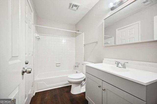 5555 Mountain Springs Cir, Stone Mountain, GA 30088 - full bath featuring wood finished floors, toilet, vanity, and tub / shower combination
