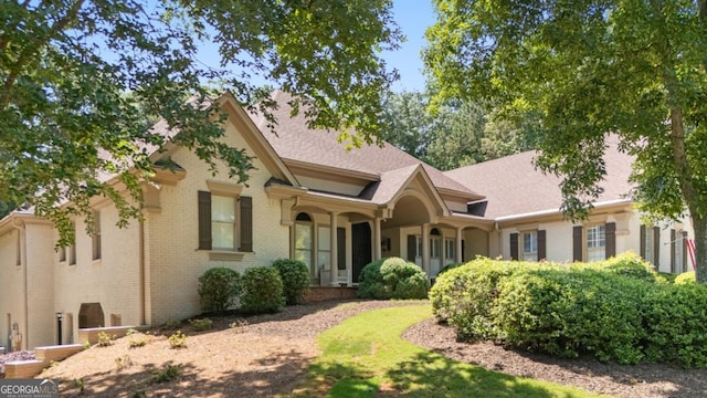 10630 N Edgewater Pl, Johns Creek, GA 30097 - view of front of home featuring brick siding and a shingled roof