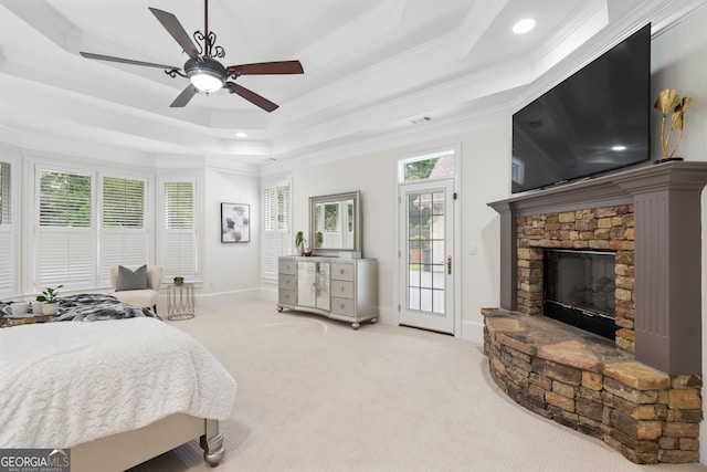10630 N Edgewater Pl, Johns Creek, GA 30097 - bedroom with crown molding, access to exterior, carpet, a stone fireplace, and multiple windows
