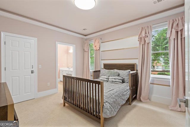 10630 N Edgewater Pl, Johns Creek, GA 30097 - carpeted bedroom with multiple windows, baseboards, ensuite bath, and crown molding