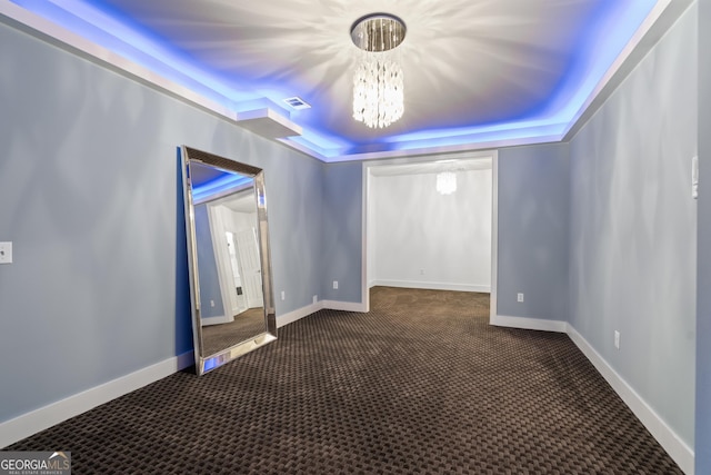 10630 N Edgewater Pl, Johns Creek, GA 30097 - carpeted spare room with a chandelier, baseboards, and a tray ceiling