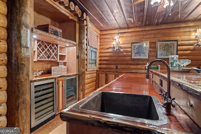 10630 N Edgewater Pl, Johns Creek, GA 30097 - indoor dry bar with wine cooler, rustic walls, wood ceiling, and light wood-style floors