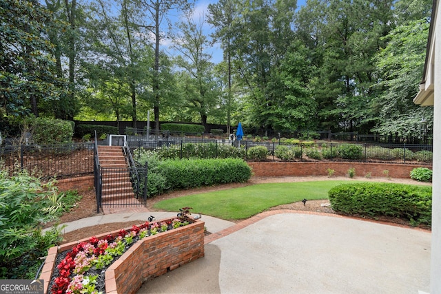 10630 N Edgewater Pl, Johns Creek, GA 30097 - view of yard featuring view of wooded area, a patio area, and stairway