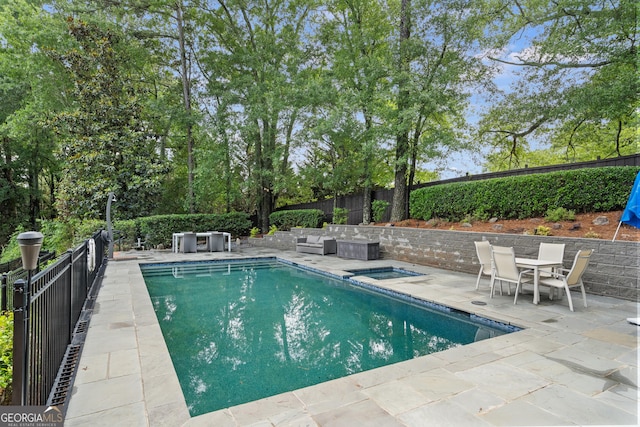 10630 N Edgewater Pl, Johns Creek, GA 30097 - view of swimming pool with a patio, an in-ground hot tub, and a fenced backyard