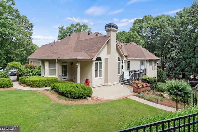 10630 N Edgewater Pl, Johns Creek, GA 30097 - rear view of house with a chimney, a shingled roof, and stucco siding