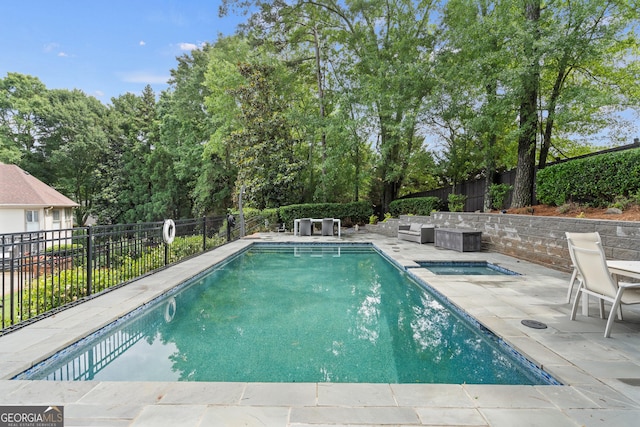 10630 N Edgewater Pl, Johns Creek, GA 30097 - view of pool with a patio area, a fenced backyard, view of scattered trees, and a pool with connected hot tub