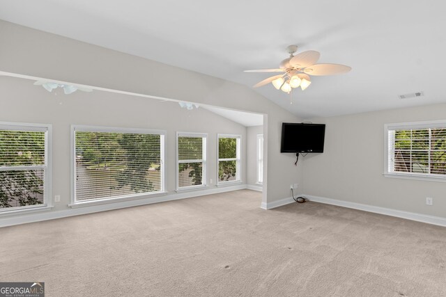 160 Birch Rd, Covington, GA 30014 - unfurnished living room with a ceiling fan, carpet flooring, vaulted ceiling, plenty of natural light, and baseboards