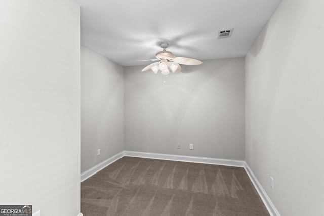 160 Birch Rd, Covington, GA 30014 - spare room featuring a ceiling fan, dark carpet, and baseboards