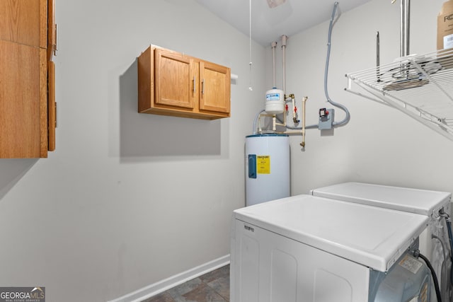 160 Birch Rd, Covington, GA 30014 - washroom featuring cabinet space, water heater, separate washer and dryer, and baseboards