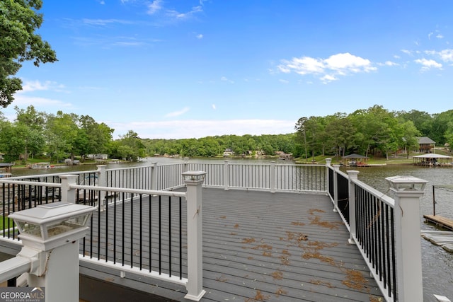 160 Birch Rd, Covington, GA 30014 - wooden deck with a water view